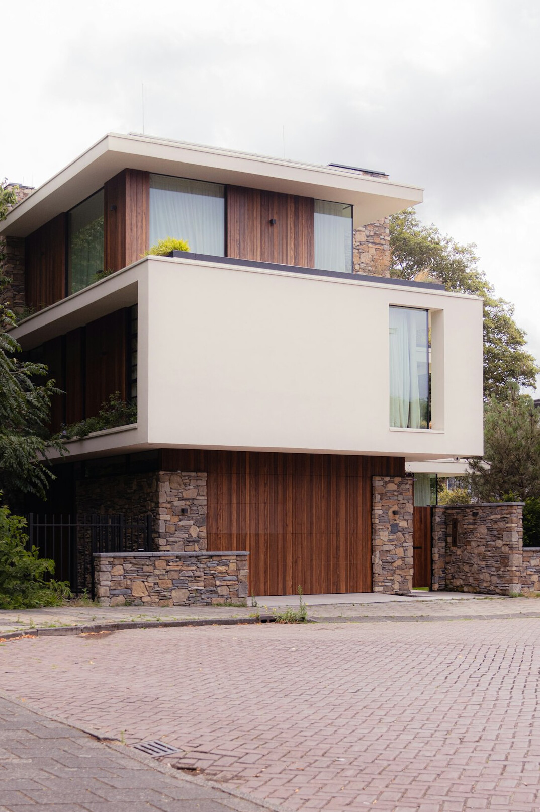 Modernist villa exterior with geometric architecture and large windows