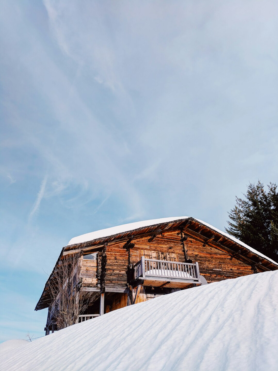 Traditional Swiss alpine chalet exterior with wooden facade in winter